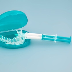 whitening trays in a protective case with a syringe of whitening gel